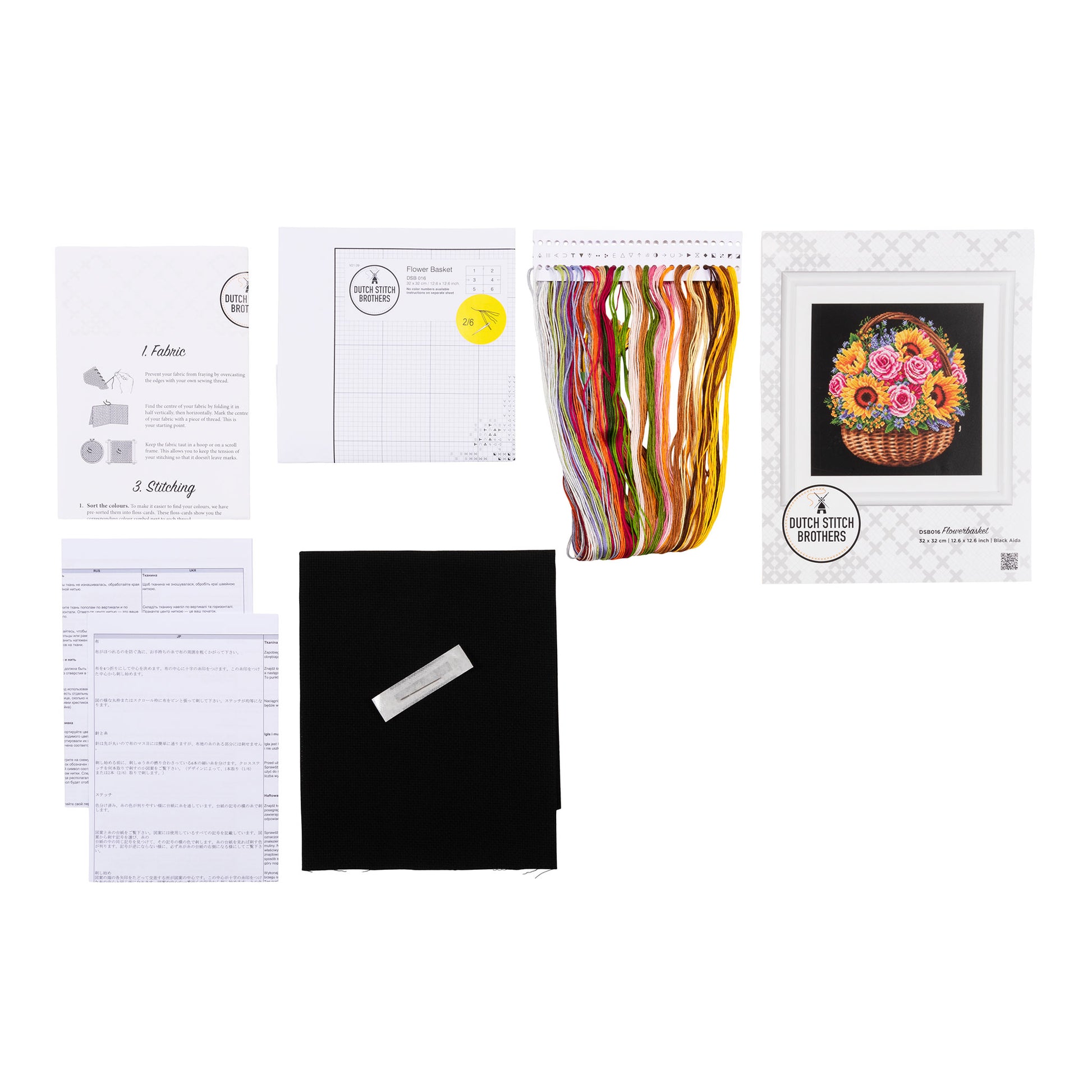 Embroidery kit with pattern and chart, needlework fabric, and threads on the floss organizer.
