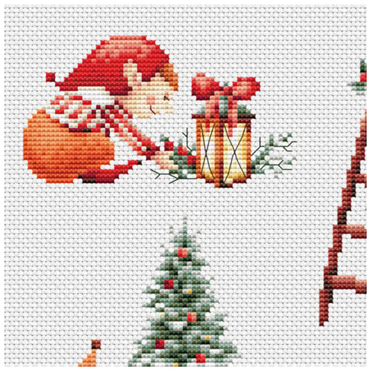 Cross-stitched design of an elf in a Santa hat with a lantern, Christmas tree, and gift box on a white background.