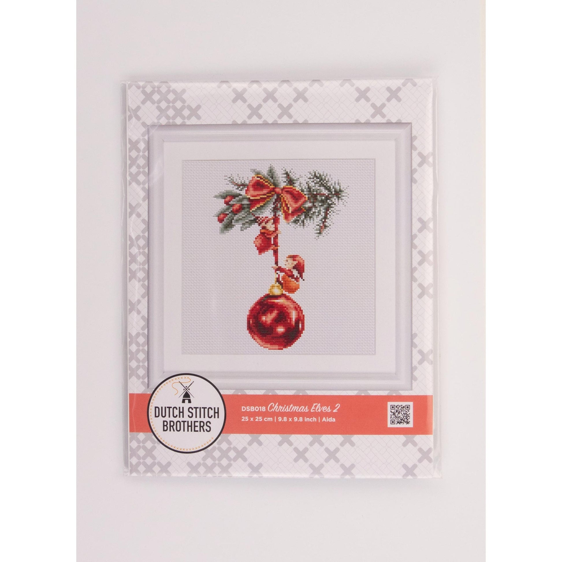 Cross-stitch packed kit with a red ornament and bow on a white background, featuring the Dutch Stitch Brothers logo.