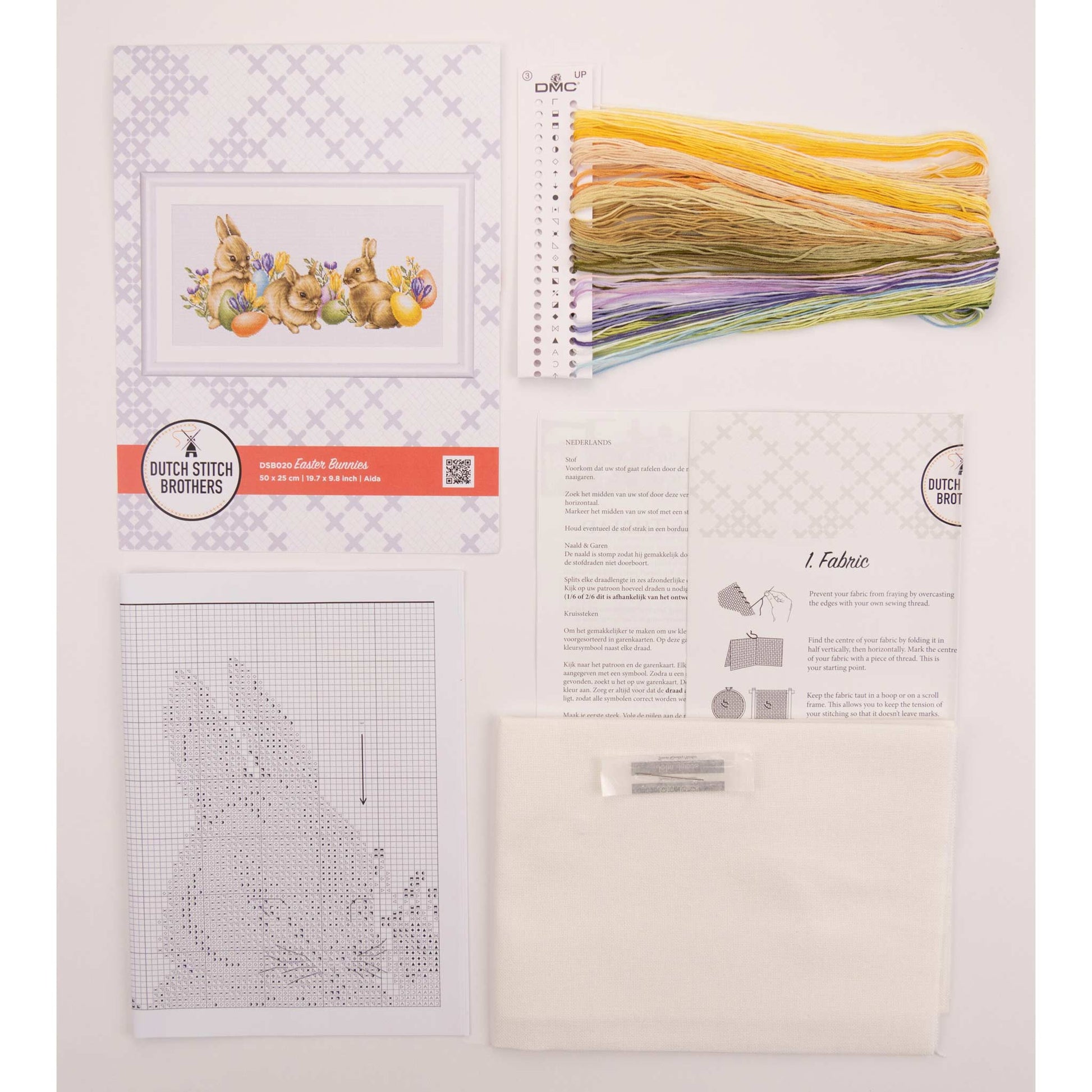 Embroidery kit with Aida needlework fabric and packaging displaying dmc embroidery threads and kit content