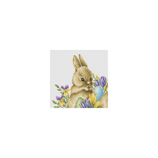 Cross-stitched design of a bunny with flowers and an egg on a white background