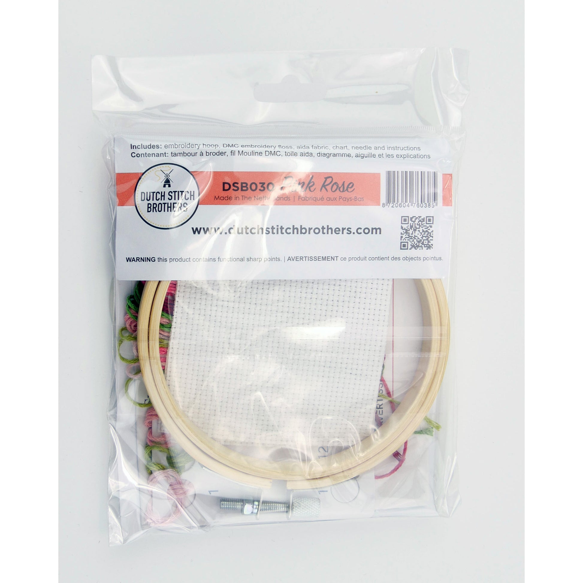Embroidery hoop with pink rose design in packaging on a white background