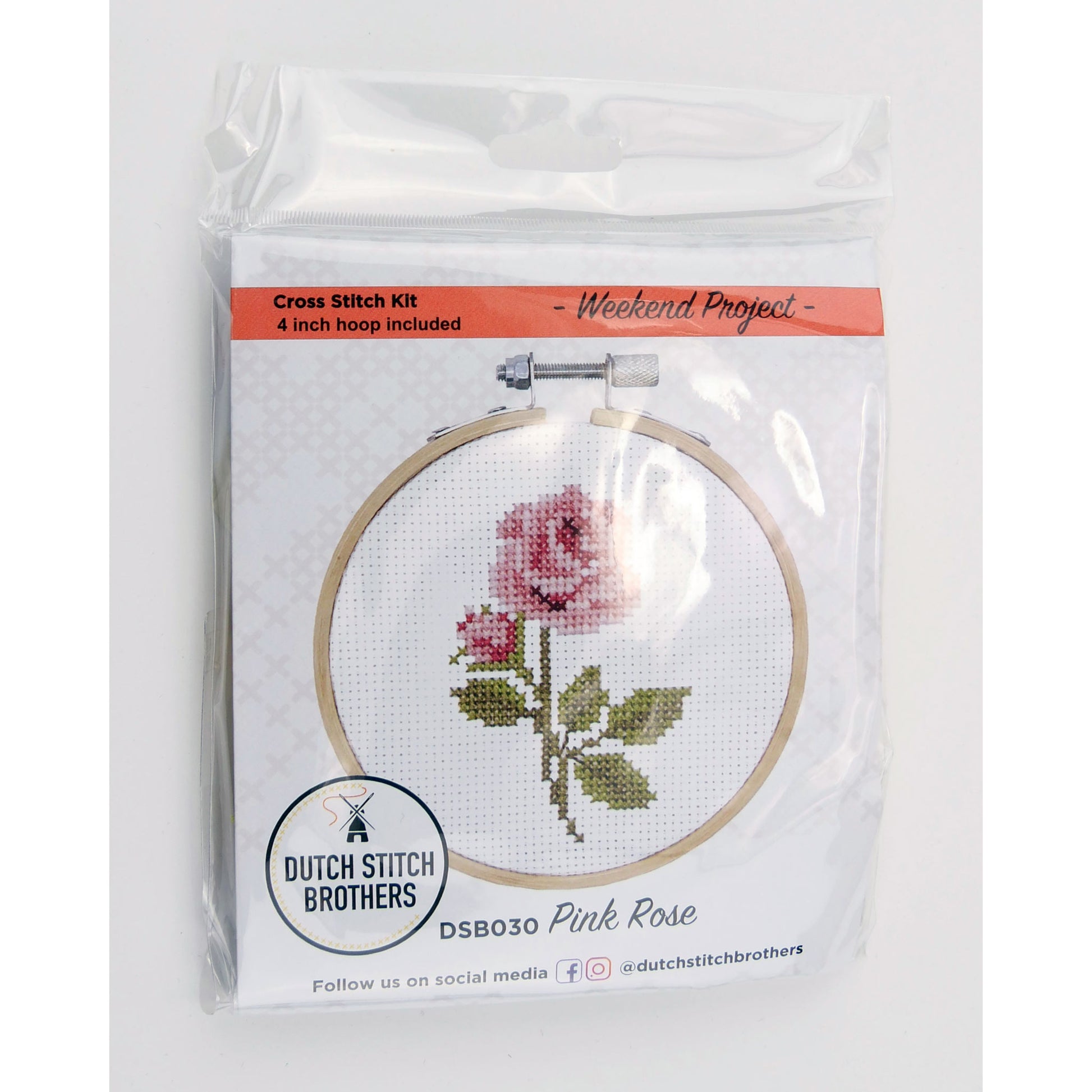 Cross stitch kit with pink rose design and hoop included, branded 'Dutch Stitch Brothers'.