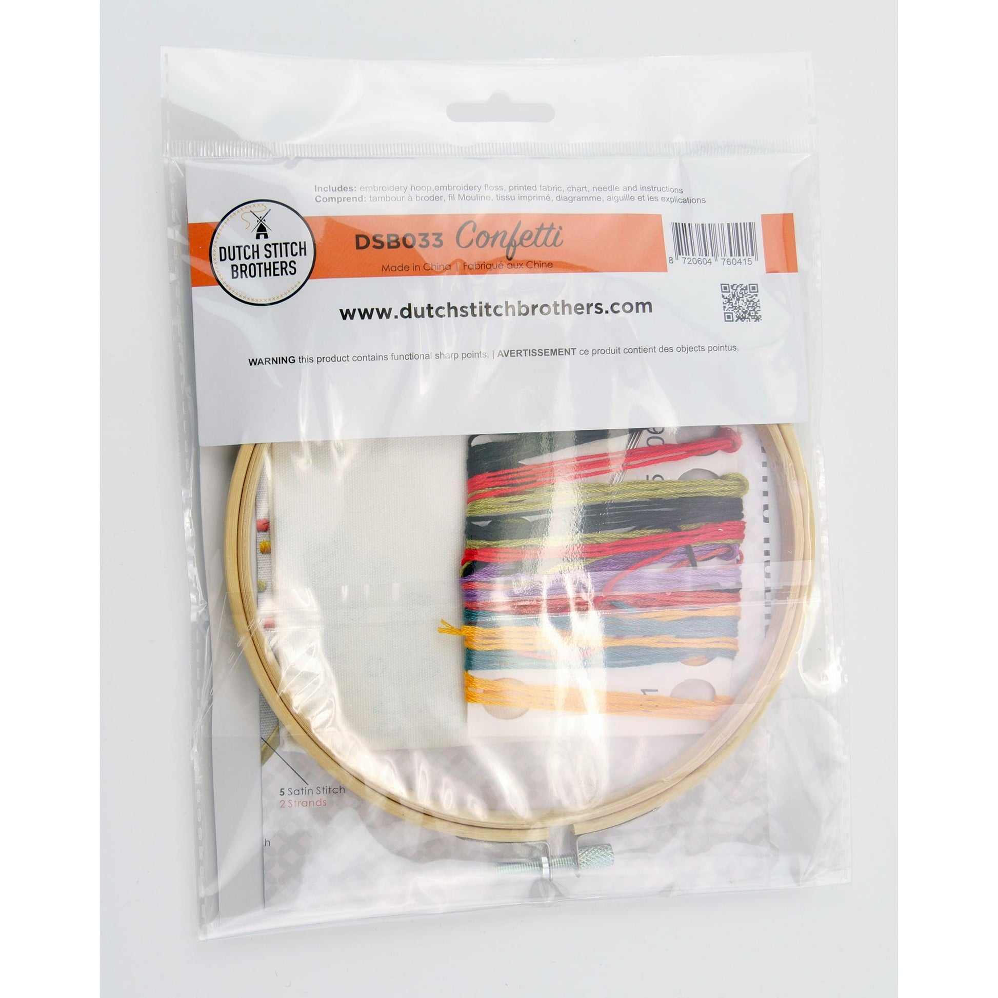 Embroidery kit with the hoop, colorful floss and packaging from Dutch Stitch Brothers on a white background