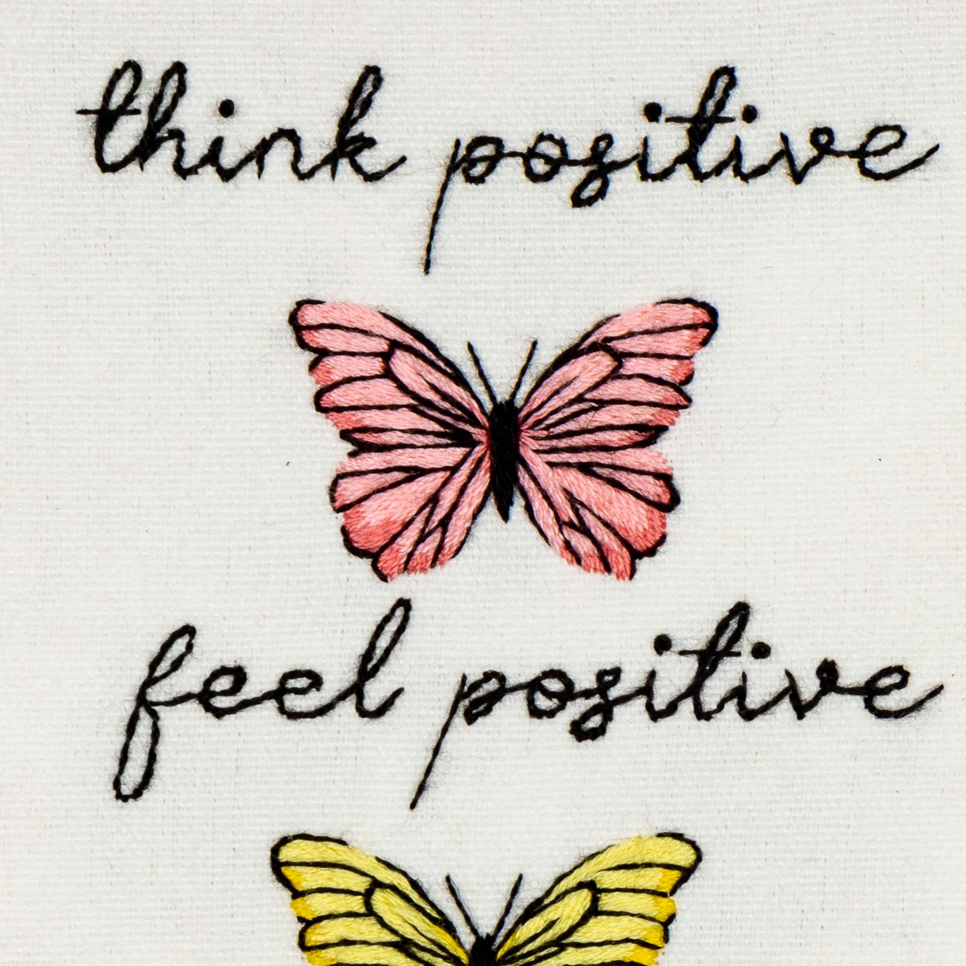 Motivational quote 'think positive feel positive' with pink and yellow butterflies stamped embroidery