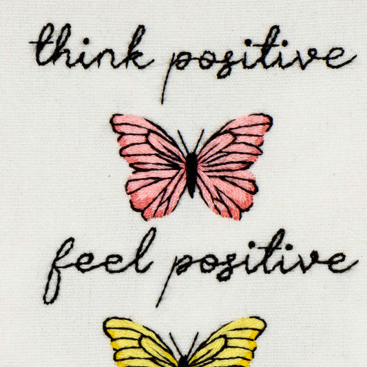Motivational quote 'think positive feel positive' with pink and yellow butterflies stamped embroidery