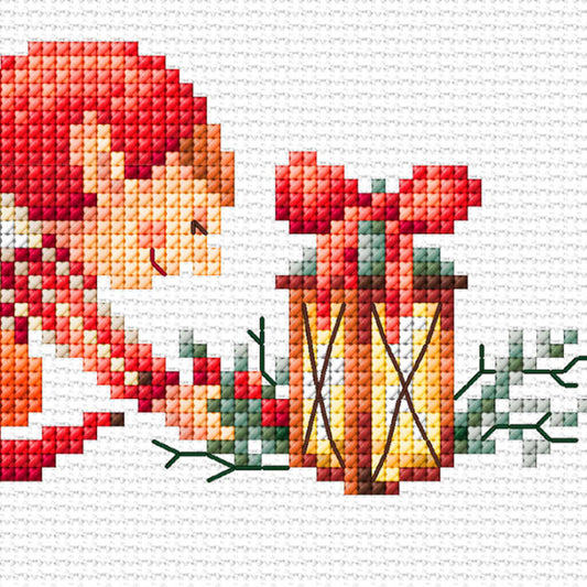 Cross-stitched design of an elf holding a Christmas lantern on a white fabric background.