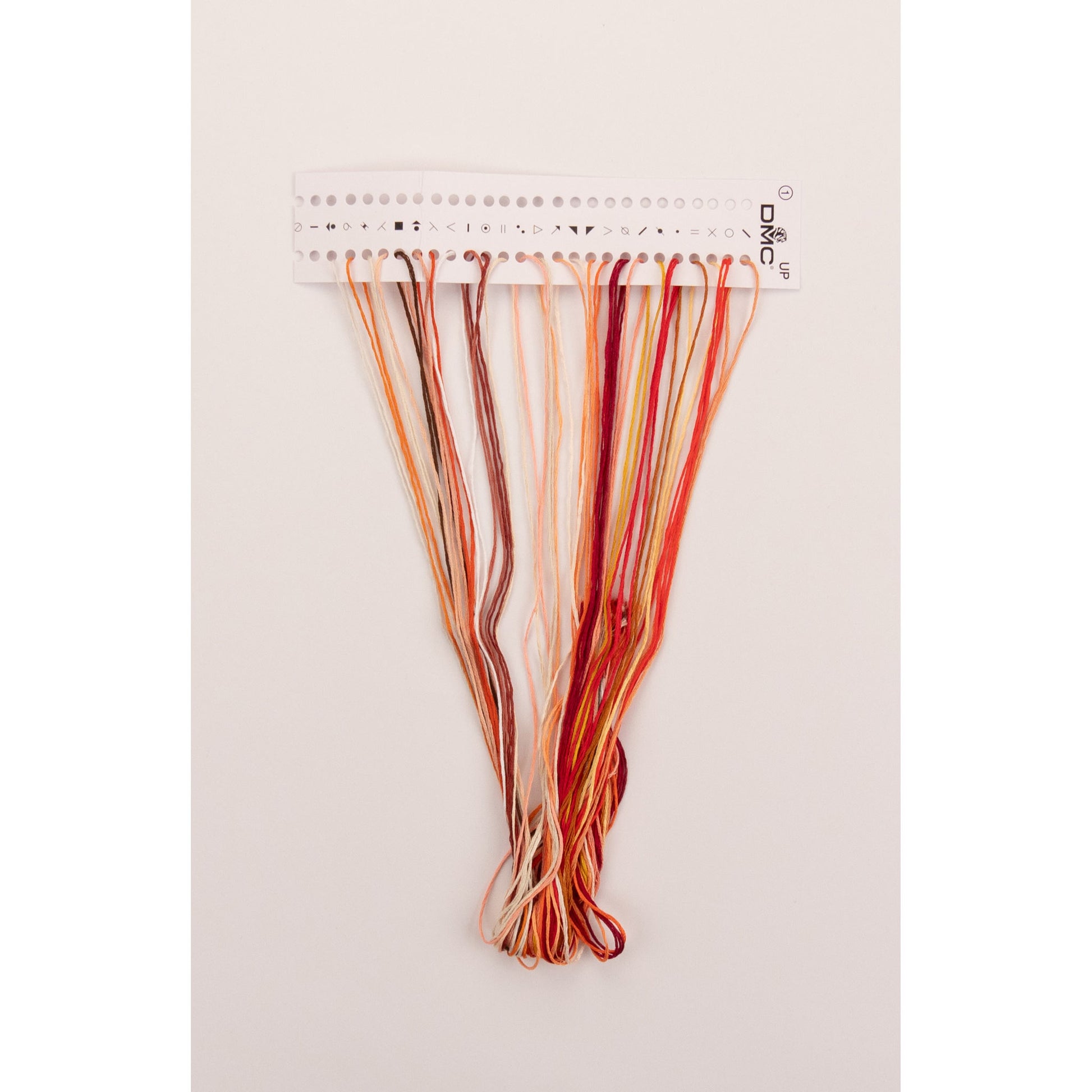 Set of presorted colorful embroidery floss on a white background 