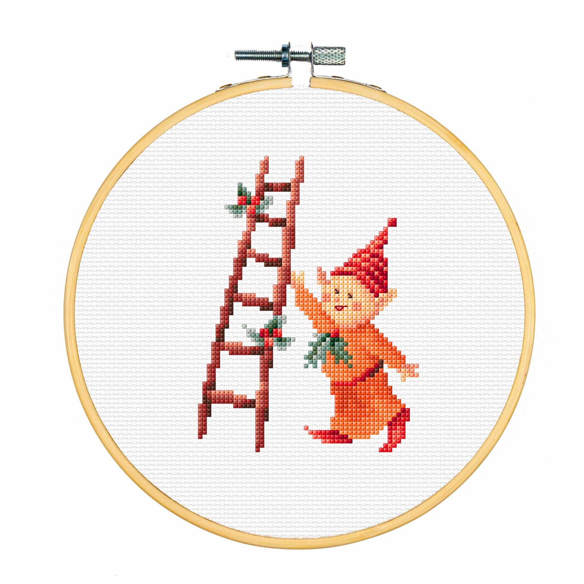 Cross-stitched elf with a ladder in a wooden hoop on a white background