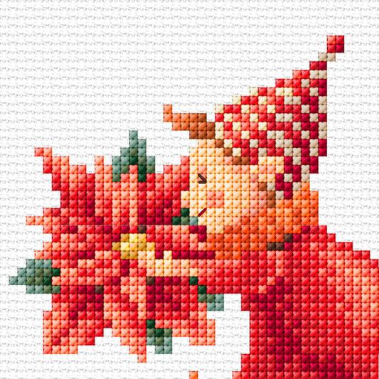 Cross-stitched pattern of a Christmas elf and flower with a red hat on a white background