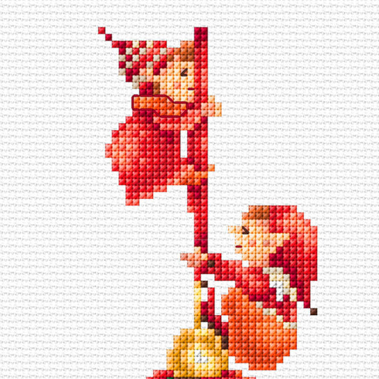 Cross-stitch pattern of two elves holding a christmas ball on a white fabric background
