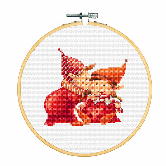 Cross-stitched design of two elves in an embroidery hoop on a white background