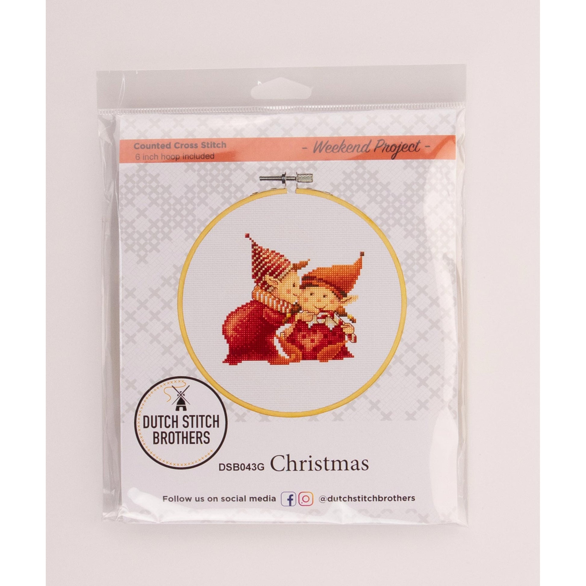 Cross-stitch kit with Christmas-themed design and 'Dutch Stitch Brothers' branding.